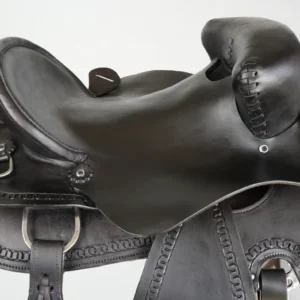 Black leather horse saddle with intricate detailing.